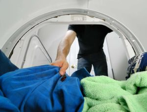 man doing laundry