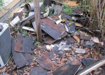 Roof Shingles Destroyed in Yard