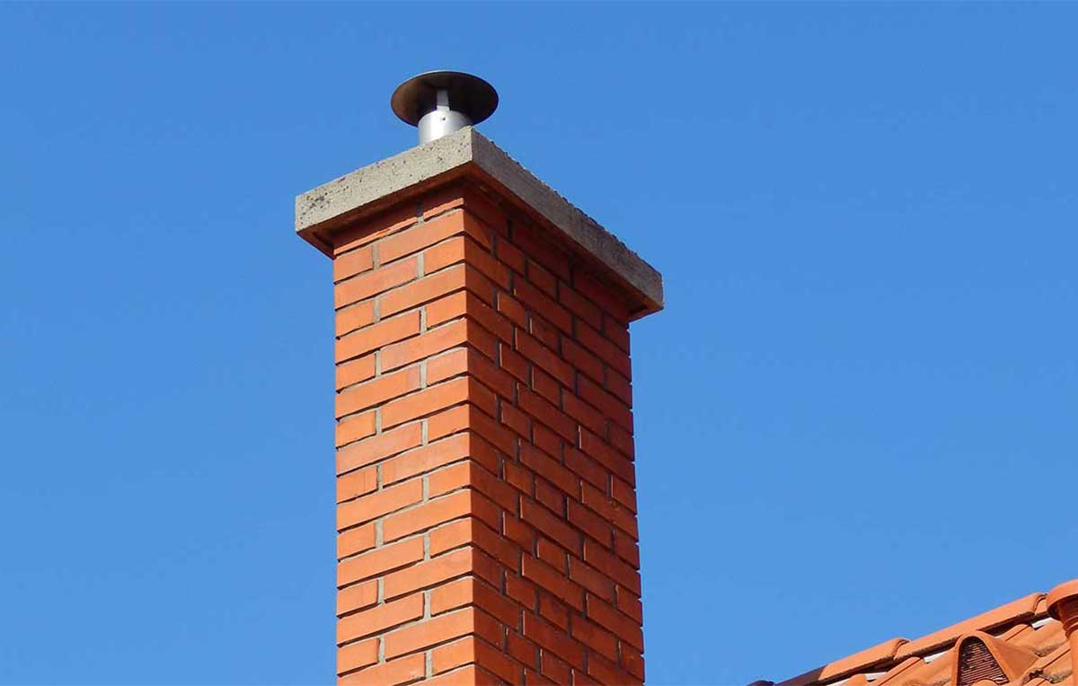 Stock Image of brown brick chimney on home