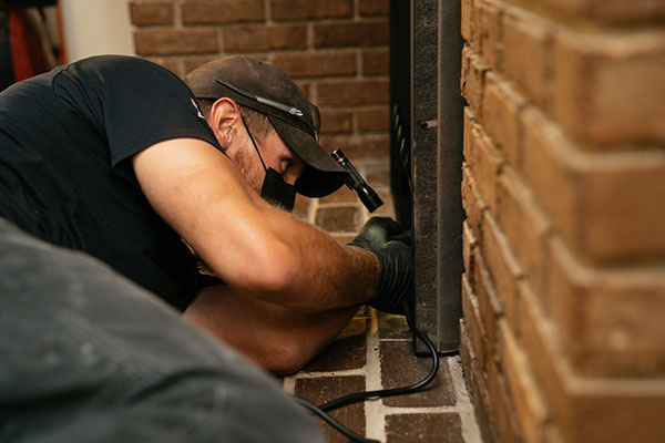Service technician inspecting Chimney