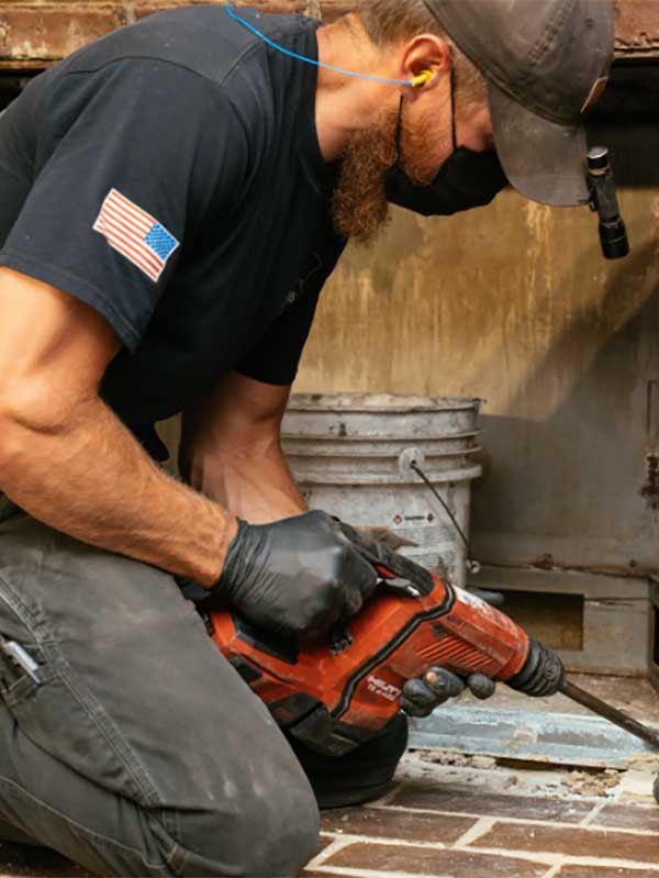 Technician removing Bricks